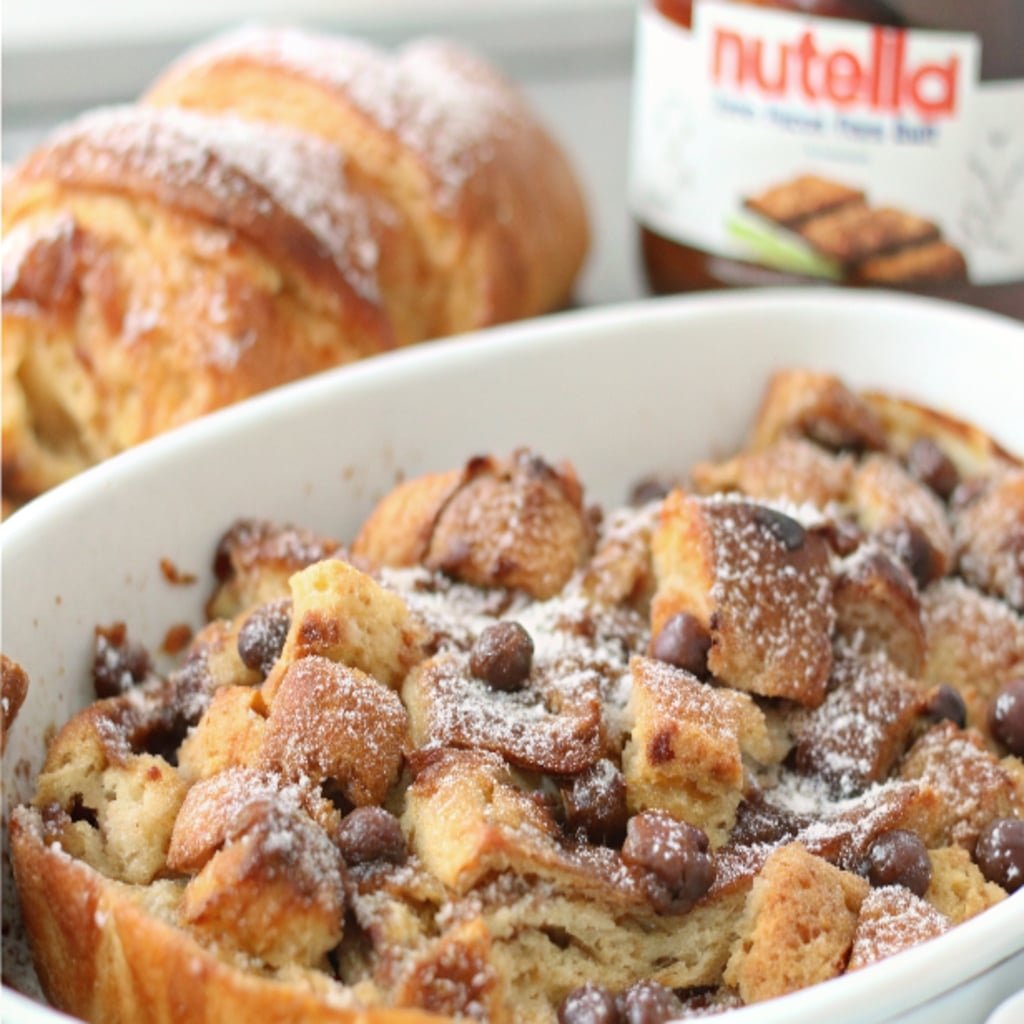 Croissant Nutella bread pudding in a white ceramic dish
