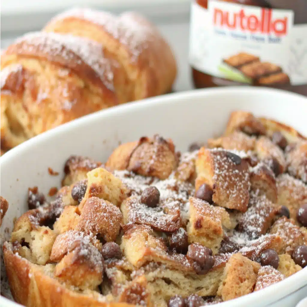 Croissant Nutella bread pudding in a white ceramic dish