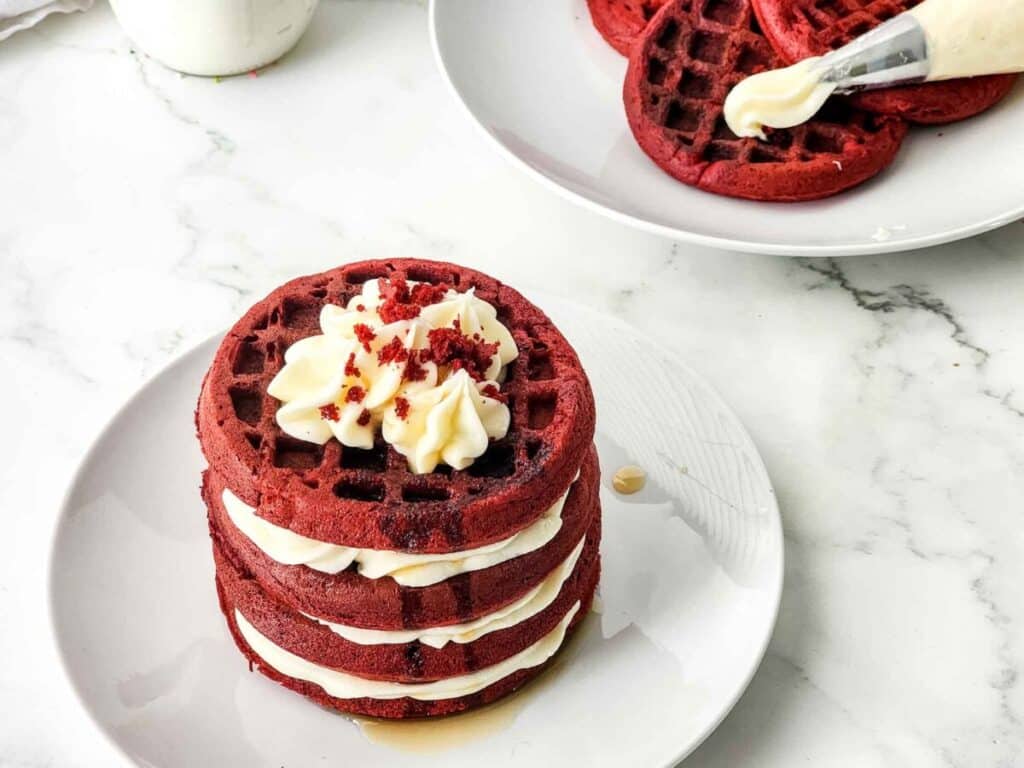 Red Velvet Waffle Cake – The Ultimate Dessert Fusion You Need to Try 6 layers of deep-red waffles, each separated by luscious cream cheese frosting