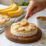 Peanut Butter and Banana Rice Cakes – The Healthy Snack You’ll Crave Daily peanut butter and banana rice cakes peanut butter and banana rice cakes being assembled