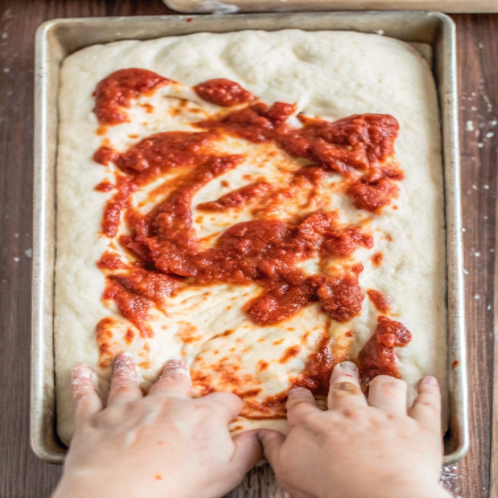 Pizza Focaccia Bread Recipe – Thick, Crispy, and Full of Flavor 9 preparing pizza focaccia bread dough before baking