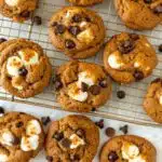 pumpkin s’mores cookies stacked with gooey marshmallows