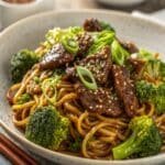 Beef and Broccoli Lo Mein in wok with noodles and broccoli