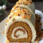 Carrot Cake Roll with Cream Cheese Frosting Filling 8 Carrot Cake Roll with Cream Cheese Frosting Filling sliced with walnuts on top