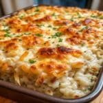 Comforting Chicken Rice Casserole bubbling with cheese
