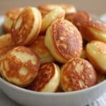Golden Easy Breakfast Pancake Poppers in a bowl