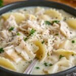 Heavenly White Chicken Lasagna Soup garnished with fresh herbs